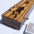 Wooden cribbage board with pegs and two packs of playing cards